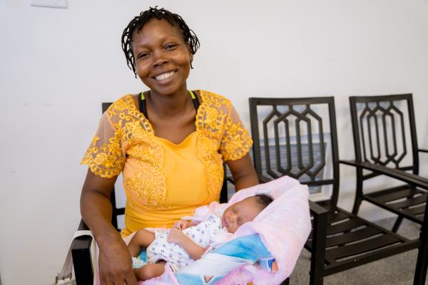 Mother holding baby at Boucan Carré Health Center